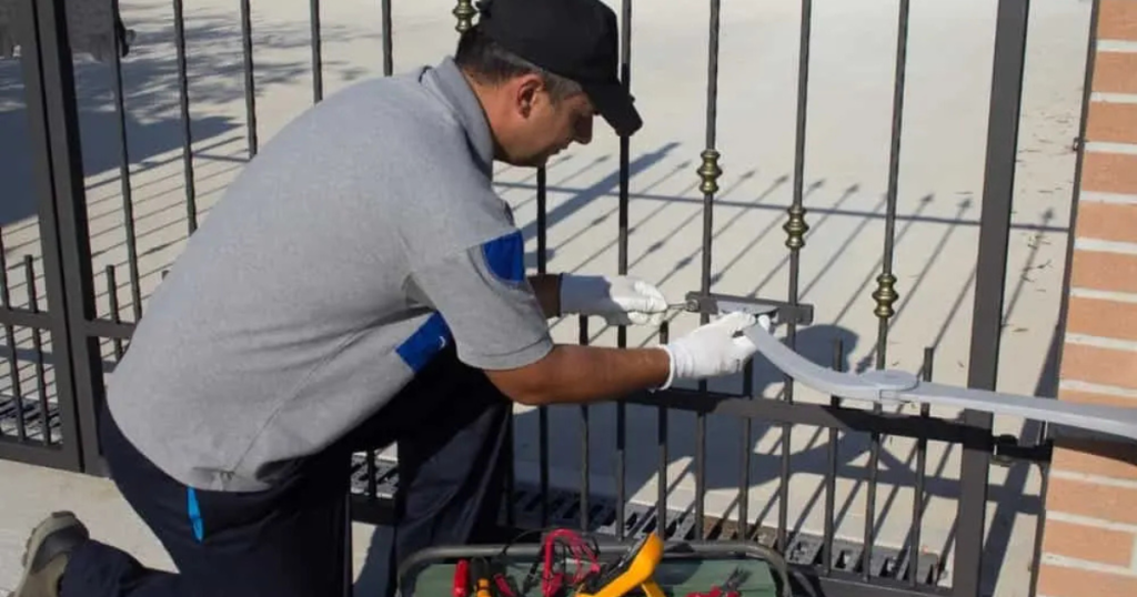 Man installing a gate lock.