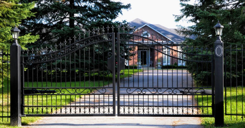 Elegant black metal gate at house entrance.